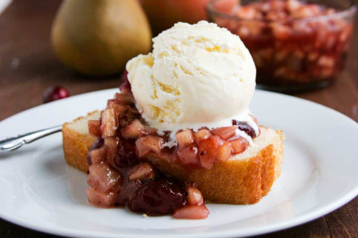 Cranberry Sauce over Pound Cake with ice cream on a plate