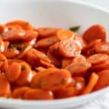 white bowl with glazed carrots