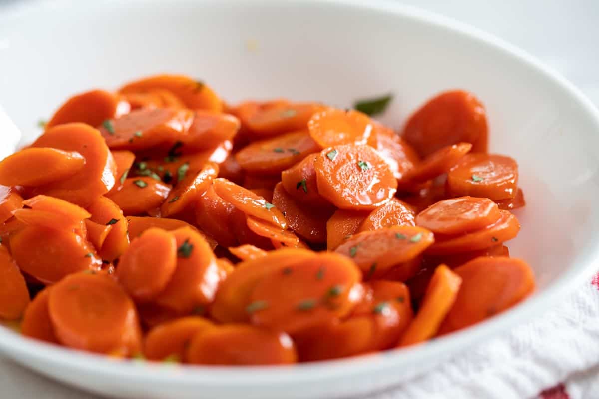 white bowl with glazed carrots