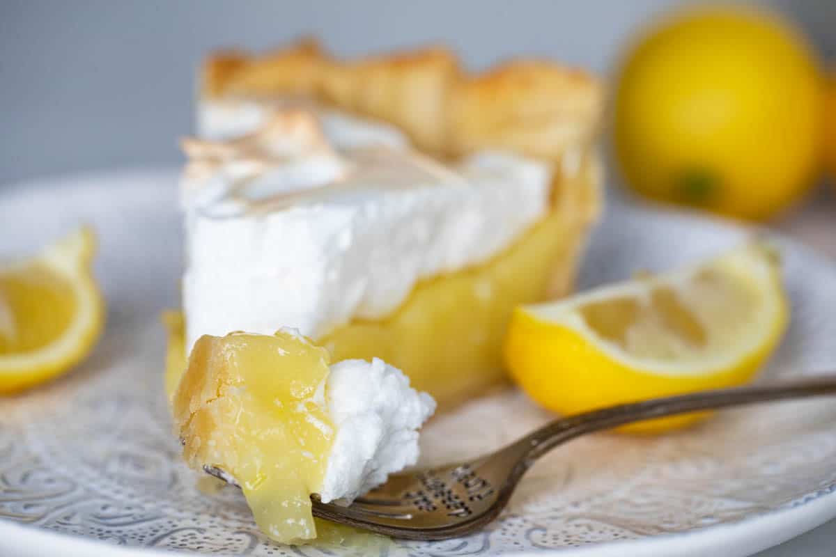 bite of lemon meringue pie on a fork