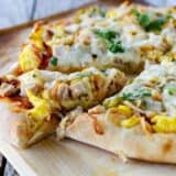 Pizza topped with turkey, eggs and Mexican flavors