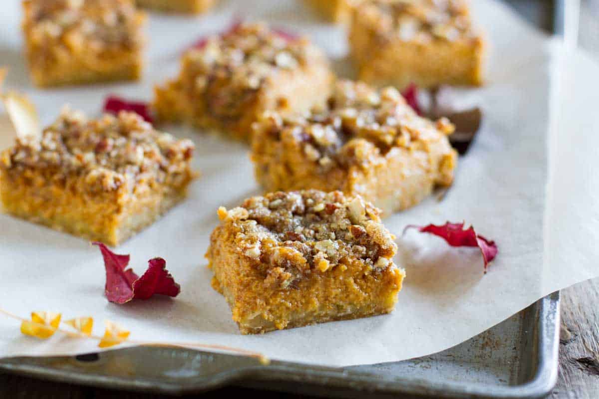 Skip the pumpkin pie this year and go for these Pumpkin Pie Bars that are so much easier to make and to eat! An easy oat crust is topped with a creamy pumpkin filling and a sugary topping to take them over the top. pumpkin pie bars with crumb topping
