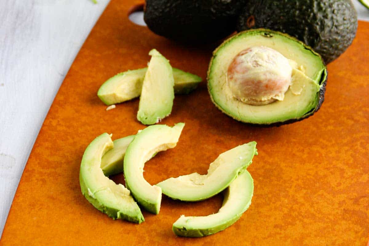 sliced avocado on a cutting board