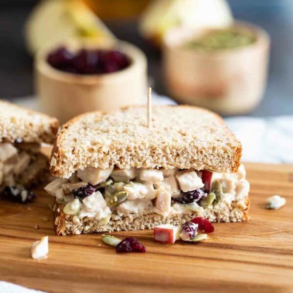 Turkey Salad Sandwich cut in half on a cutting board