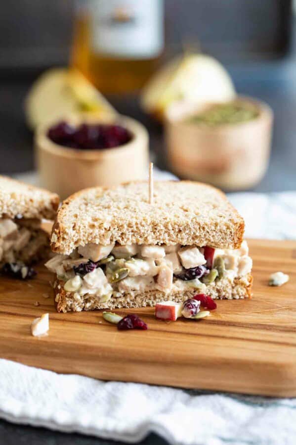 Turkey Salad Sandwich cut in half on a cutting board