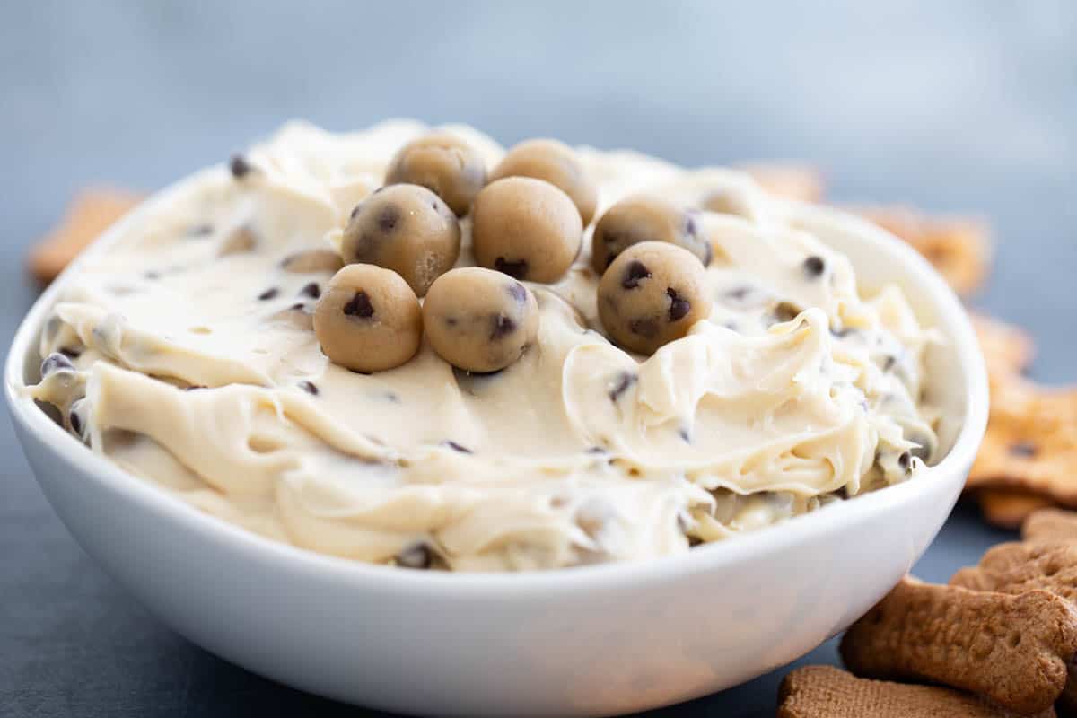 bowl of Chocolate Chip Cookie Dough Dip with cookie dough balls on top