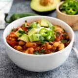 bowl of ground turkey chili with toppings