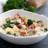 Bowl of Zuppa Toscana topped with bacon