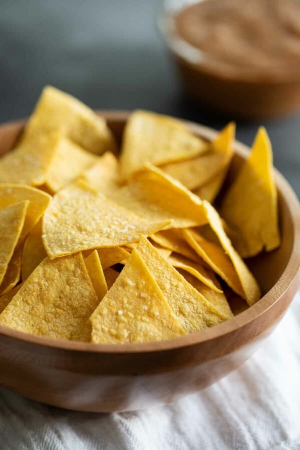 wooden bowl filled with homemade tortilla chips