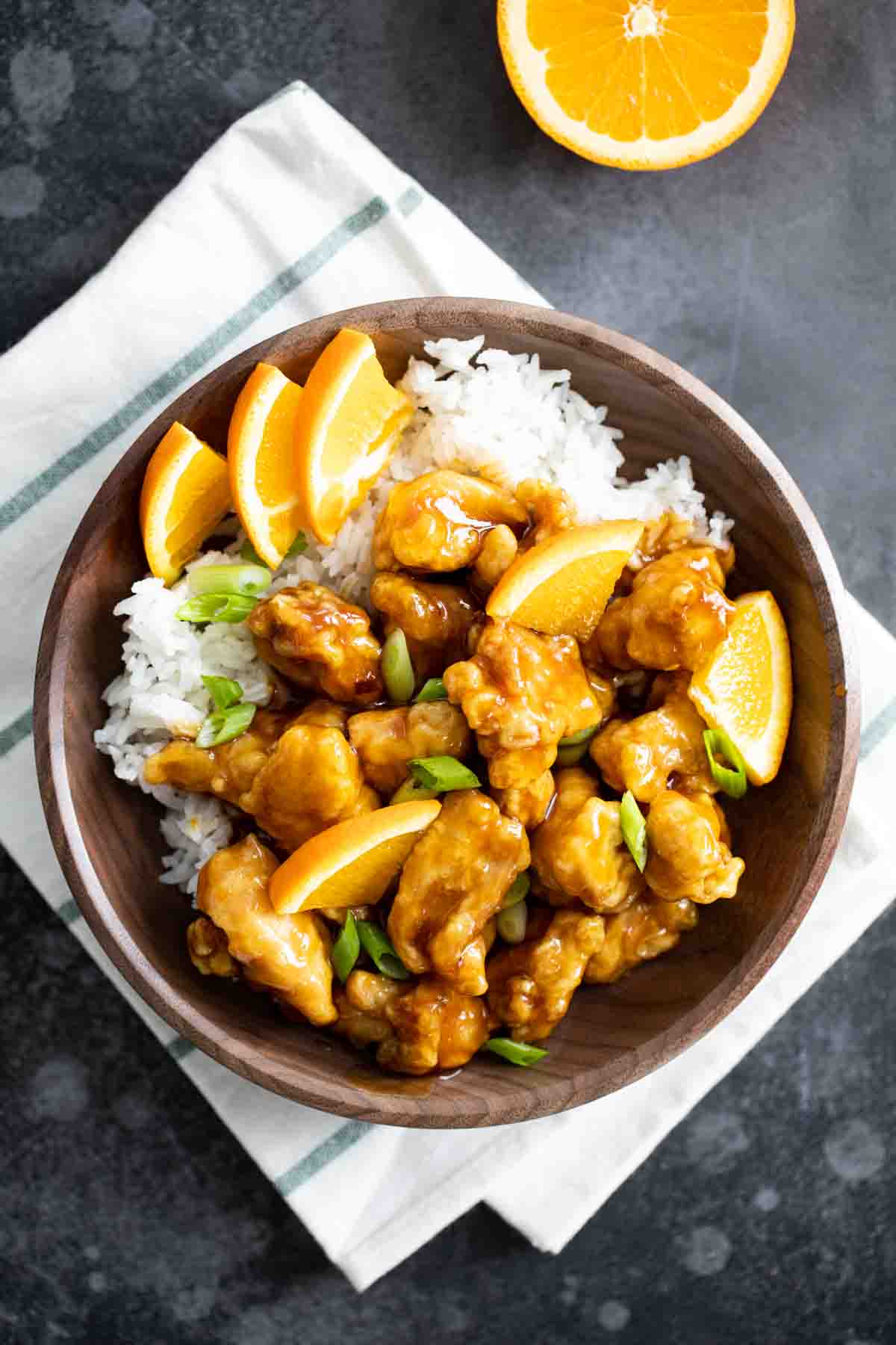 overhead view of bowl with rice and orange chicken