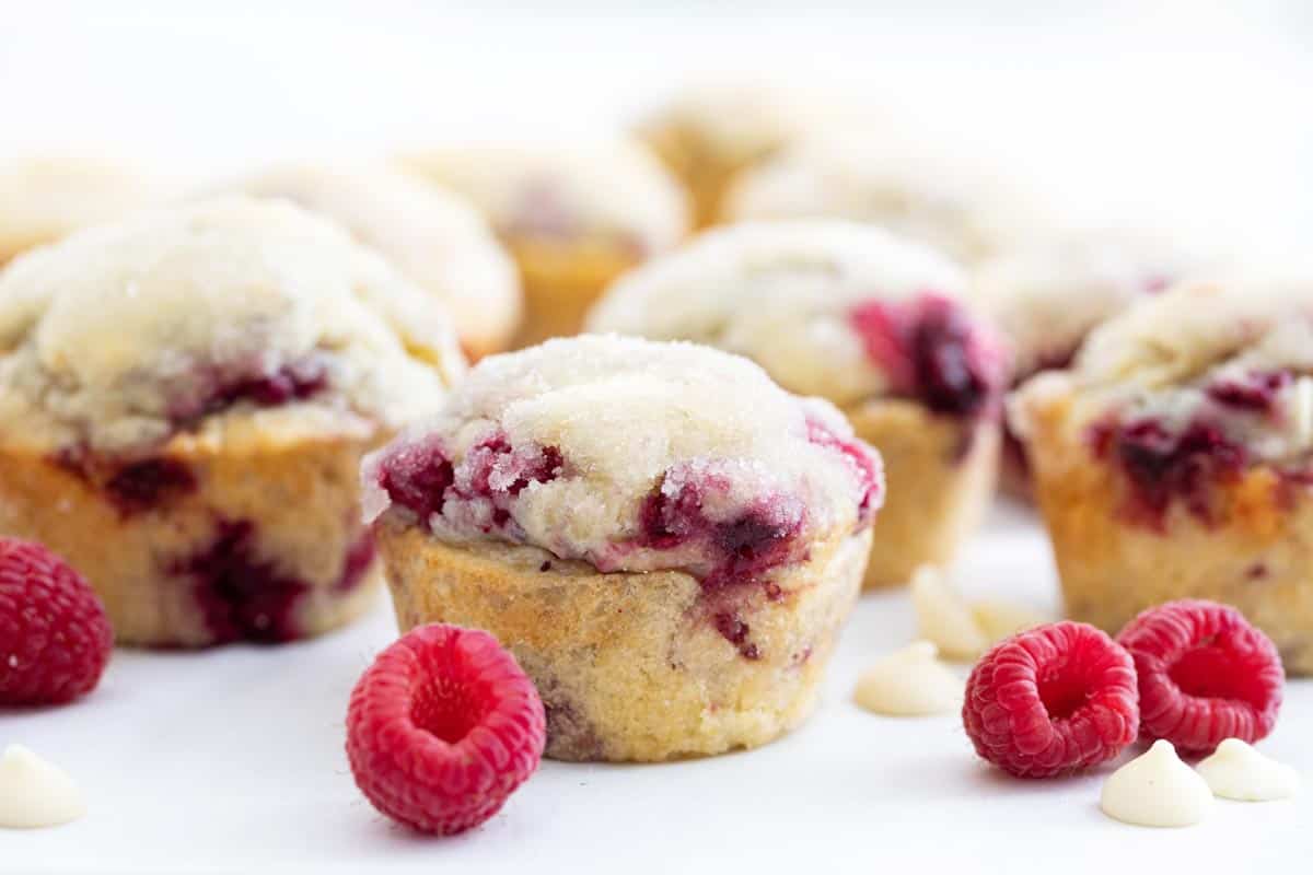 Sweet raspberries and creamy white chocolate make these Raspberry Muffins with White Chocolate Chips a special breakfast treat! They are soft and moist and perfectly sweet. raspberry muffins with white chocolate chips with fresh raspberries