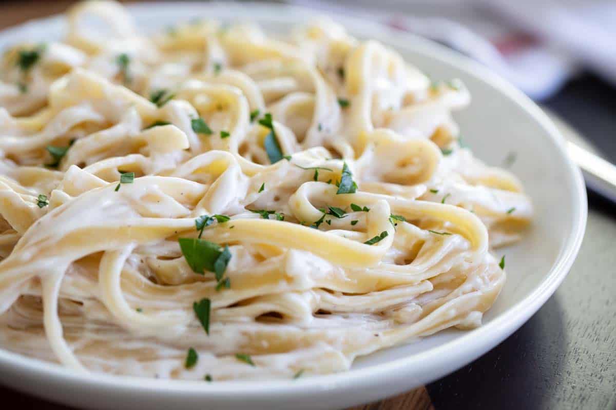 close up of fettuccine alfredo on a plate