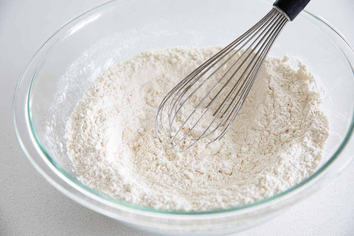 homemade pancake mix in a large bowl with a whisk