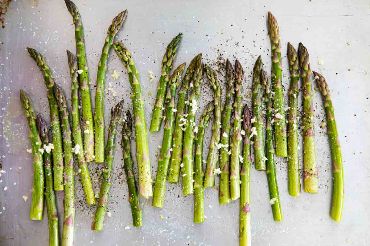 asparagus with garlic on a baking sheet