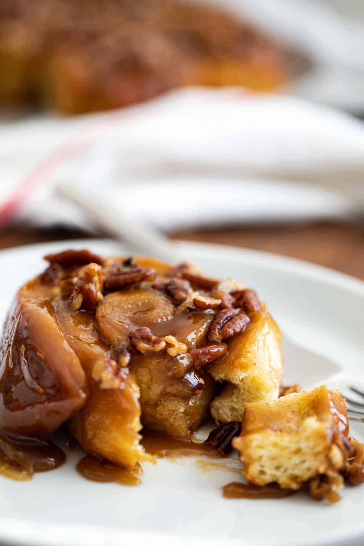 sticky bun with a bite forkful taken from it