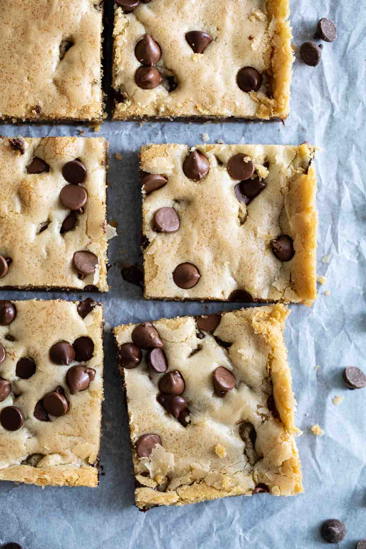 These Chocolate Chip Cookie Bars are soft, moist and addictive. Made with oil instead of butter, they stay nice and tender. overhead view of chocolate chip cookie bars