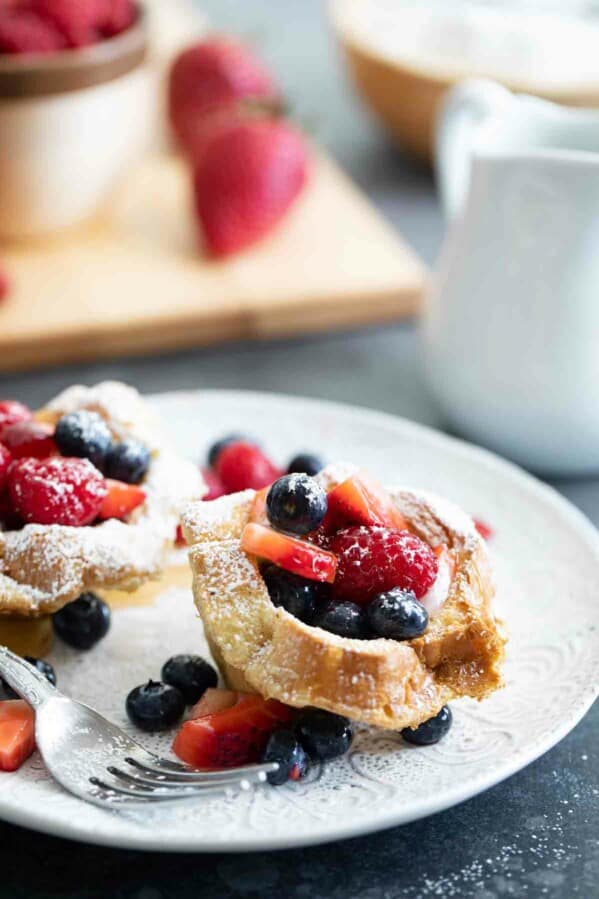 French Toast Cups filled with fresh berries on a plate