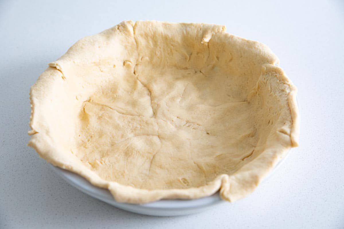 crescent roll crust in a pie dish