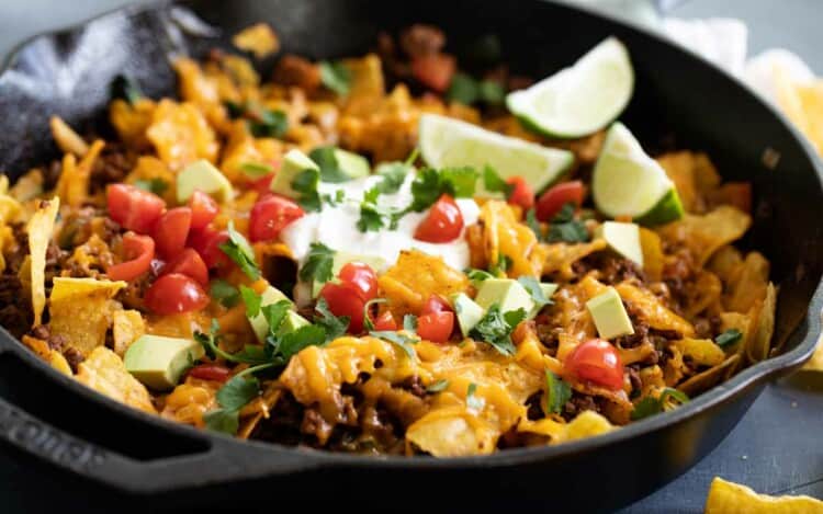 taco skillet in a cast iron skillet with toppings