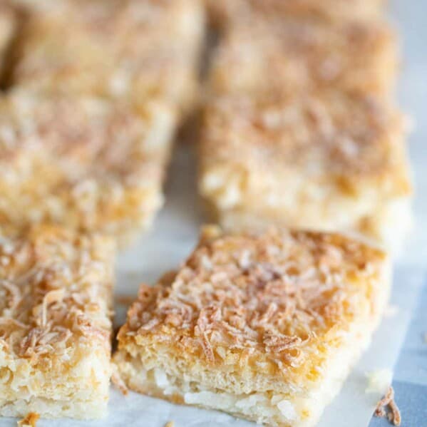 cut coconut bars on a piece of parchment paper