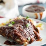 Instant pot ribs with barbecue sauce on a plate
