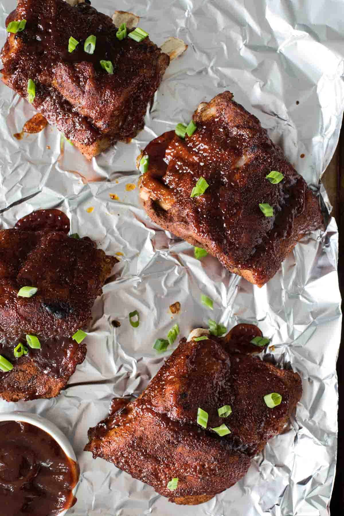 overhead view of barbecue ribs on foil