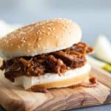 bbq beef sandwich on a wooden board