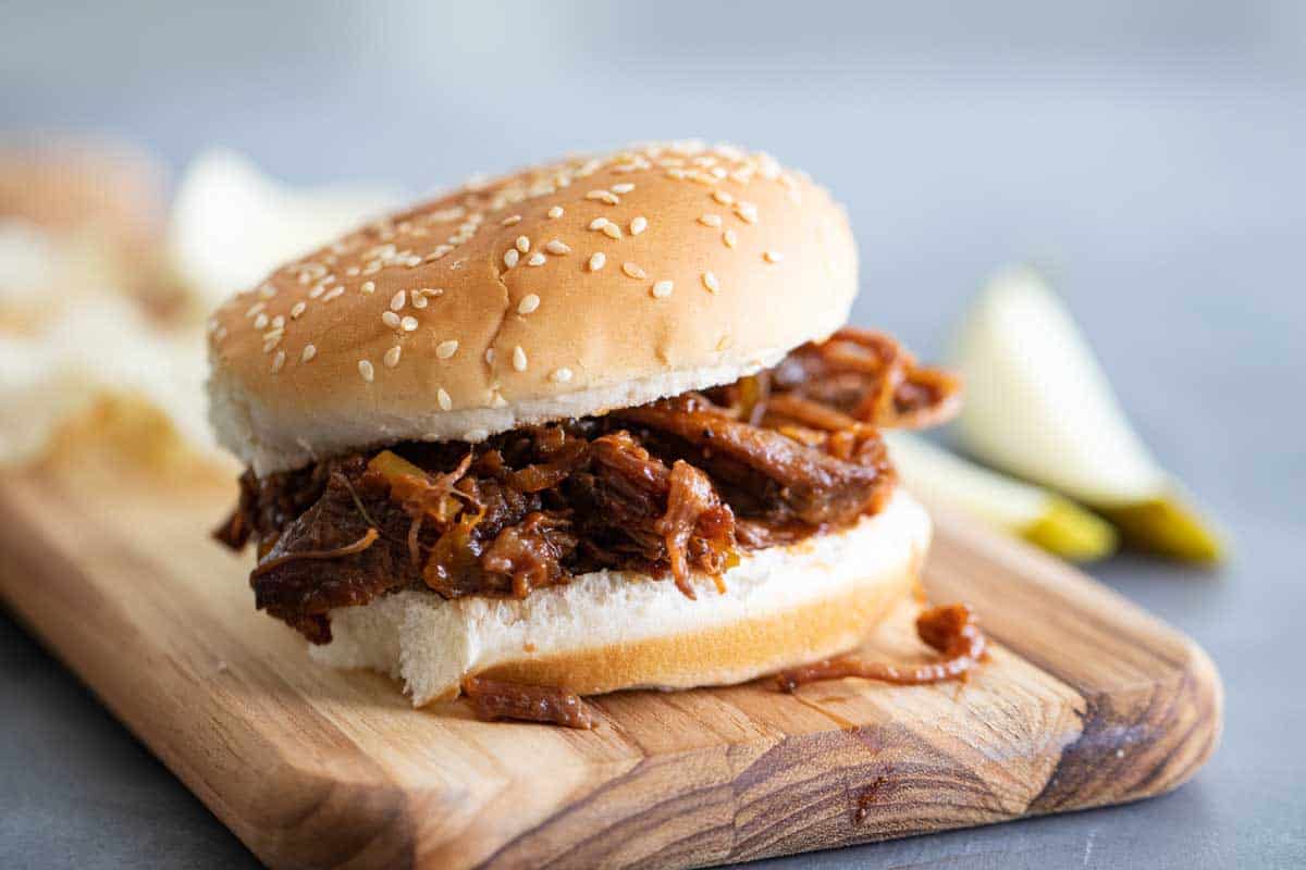 bbq beef sandwich on a wooden board