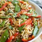 dish with lo mein noodles with cabbage, peas and peppers