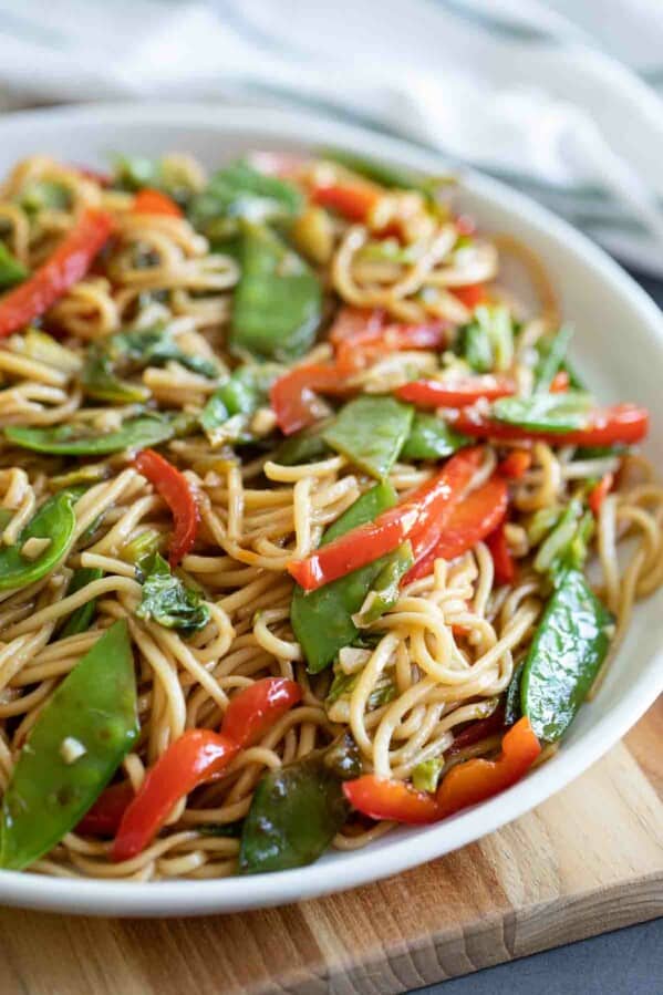 dish with lo mein noodles with cabbage, peas and peppers