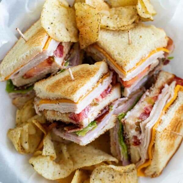 overhead view of cut up club sandwich in a basket