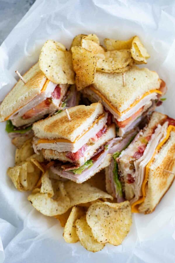 overhead view of cut up club sandwich in a basket