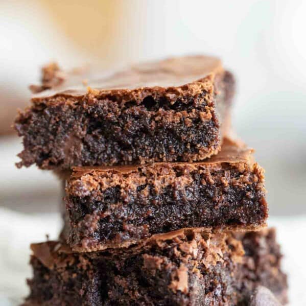 three fudgy brownies stacked