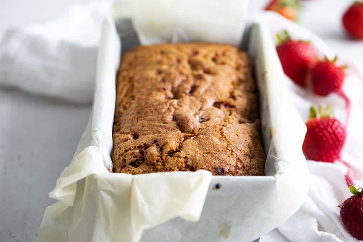 loaf of strawberry bread in a baking pan.