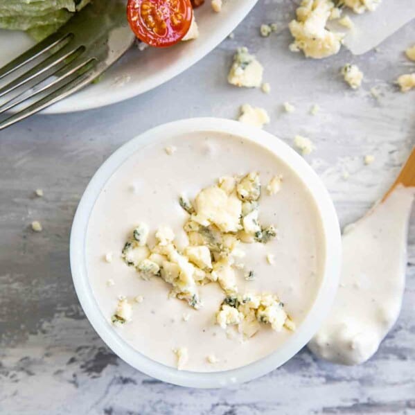 overhead view of creamy blue cheese dressing with crumbled blue cheese on top