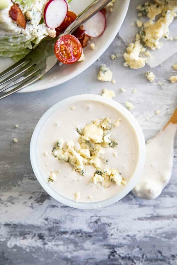 overhead view of creamy blue cheese dressing with crumbled blue cheese on top