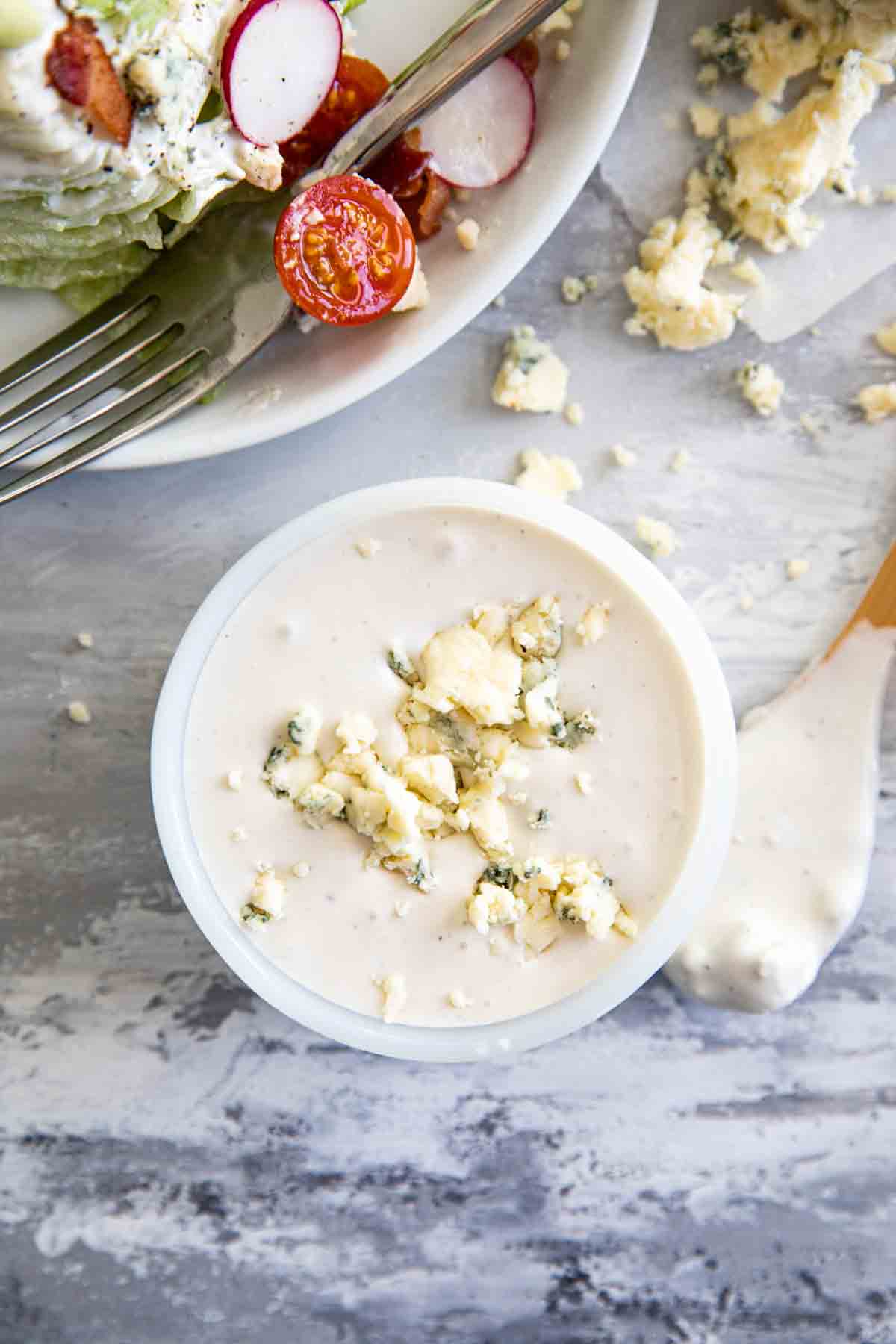 overhead view of creamy blue cheese dressing with crumbled blue cheese on top