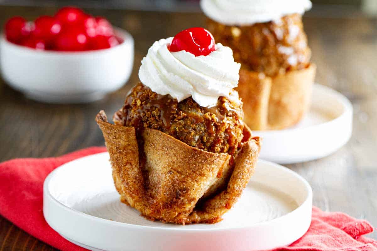 Fried ice cream in a cinnamon sugar tortilla bowl topped with whipped cream