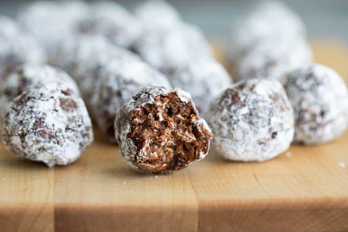 No bake peanut butter oatmeal balls with a bite taken from one