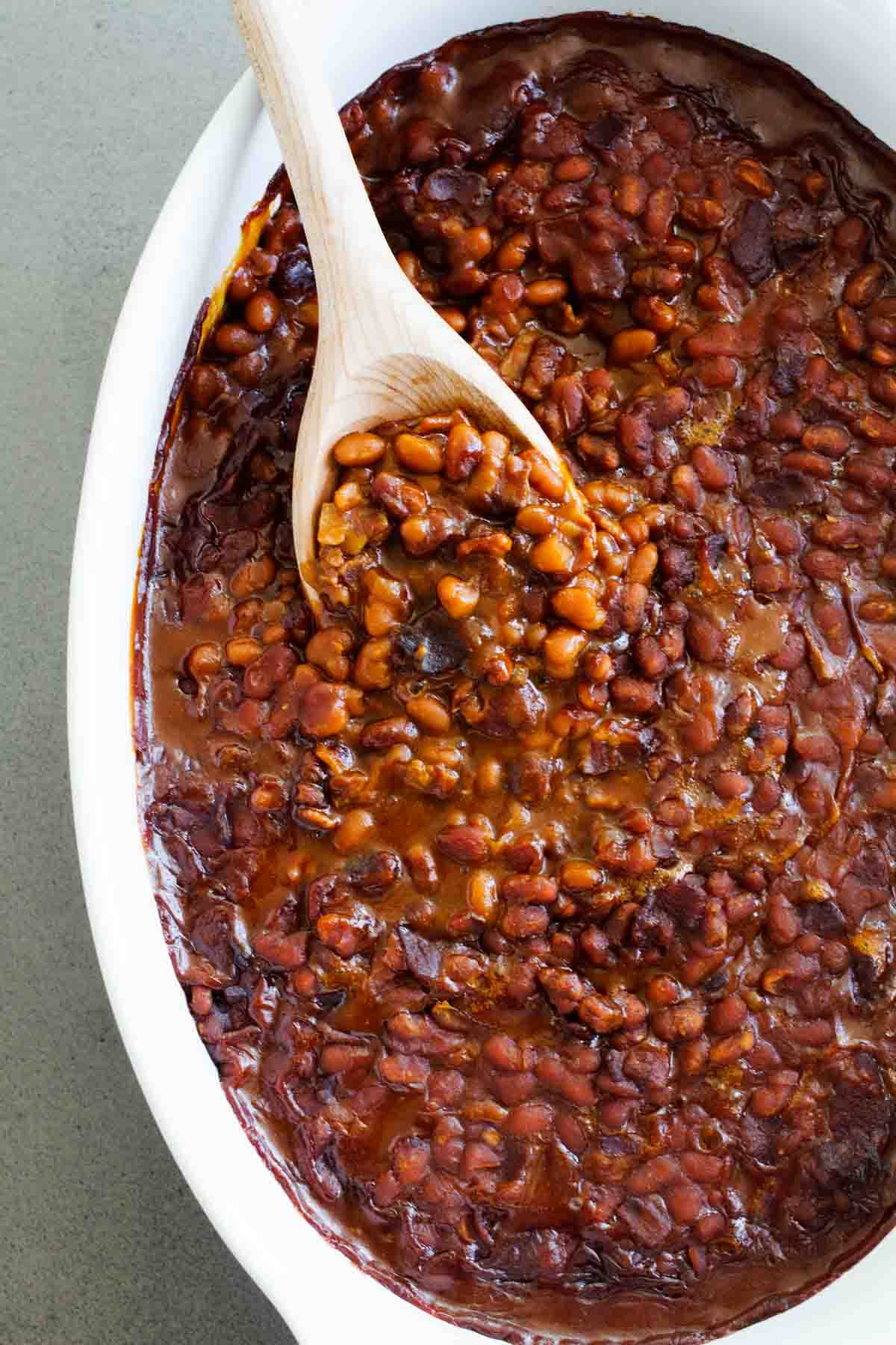 overhead view of dish of baked beans with bacon