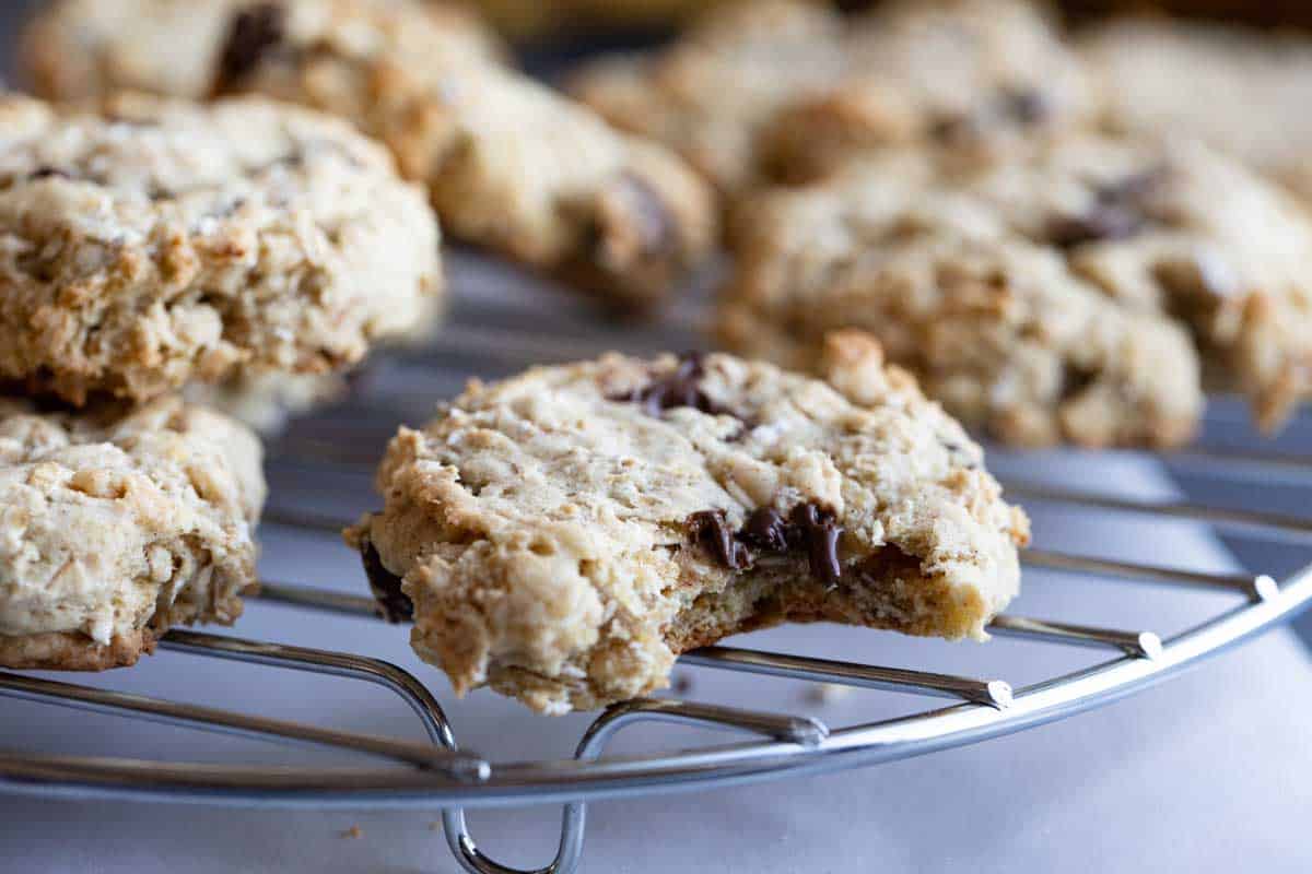 Banana Oatmeal Cookies on a cooling rack with bite taken from one cookie