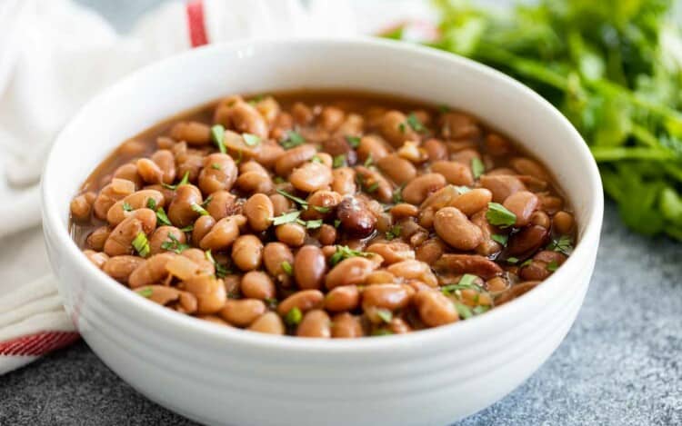 white bowl of instant pot pinto beans