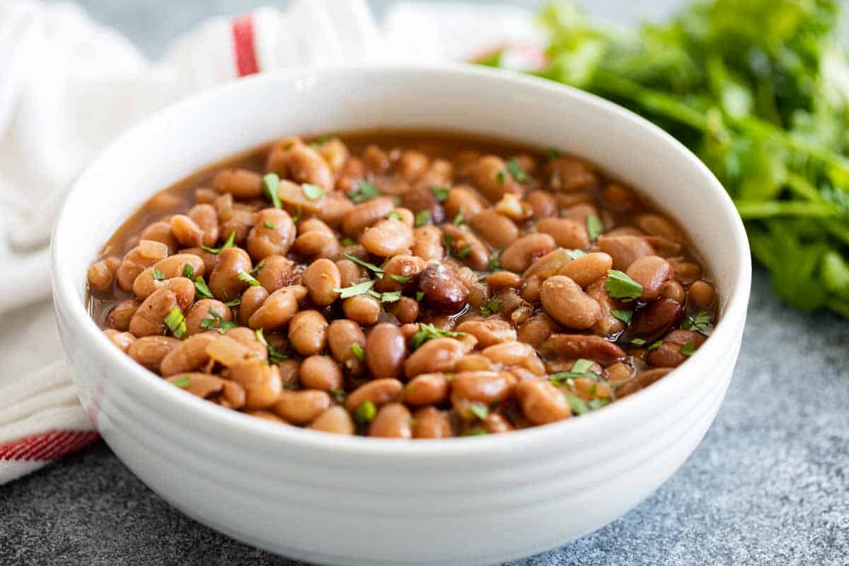 white bowl of instant pot pinto beans