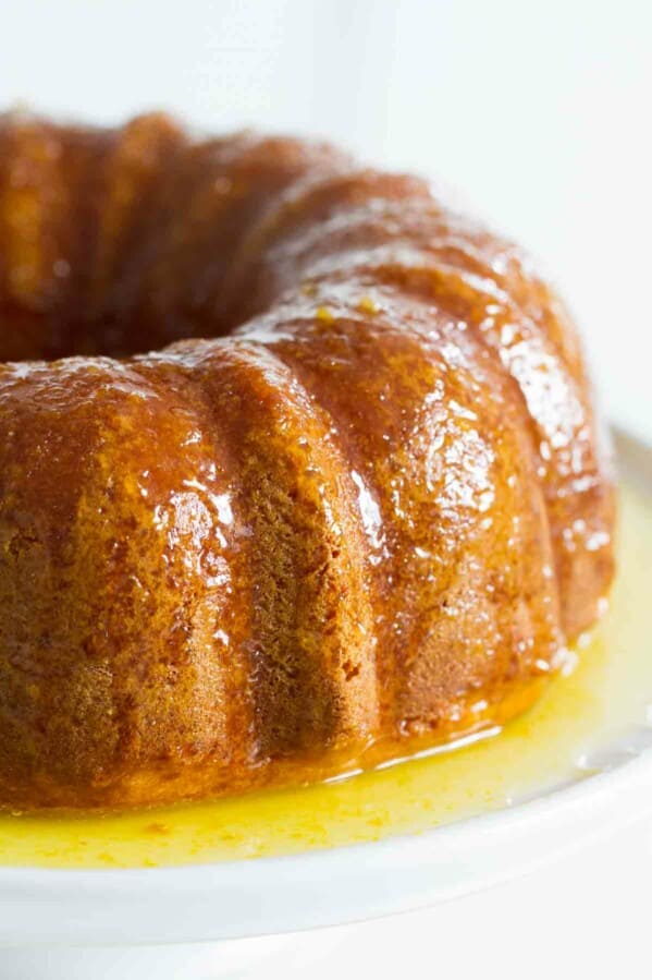 orange cake with orange glaze on a platter