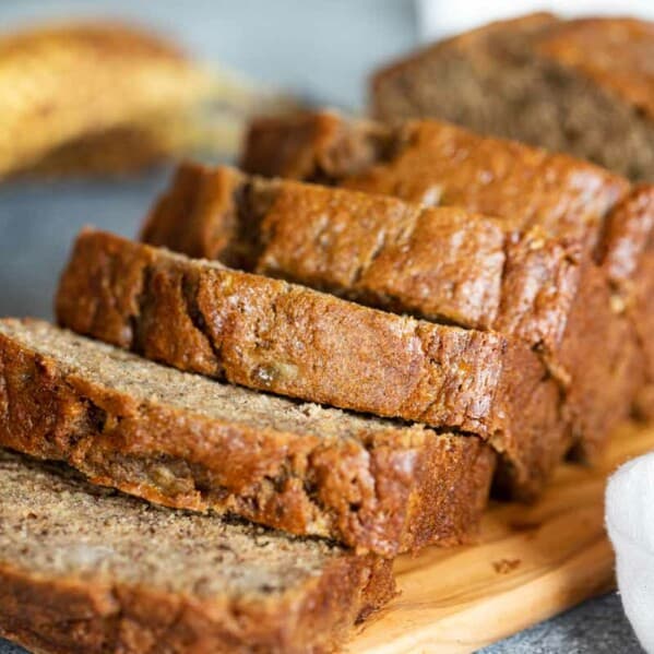 loaf of sliced banana bread on a cutting board