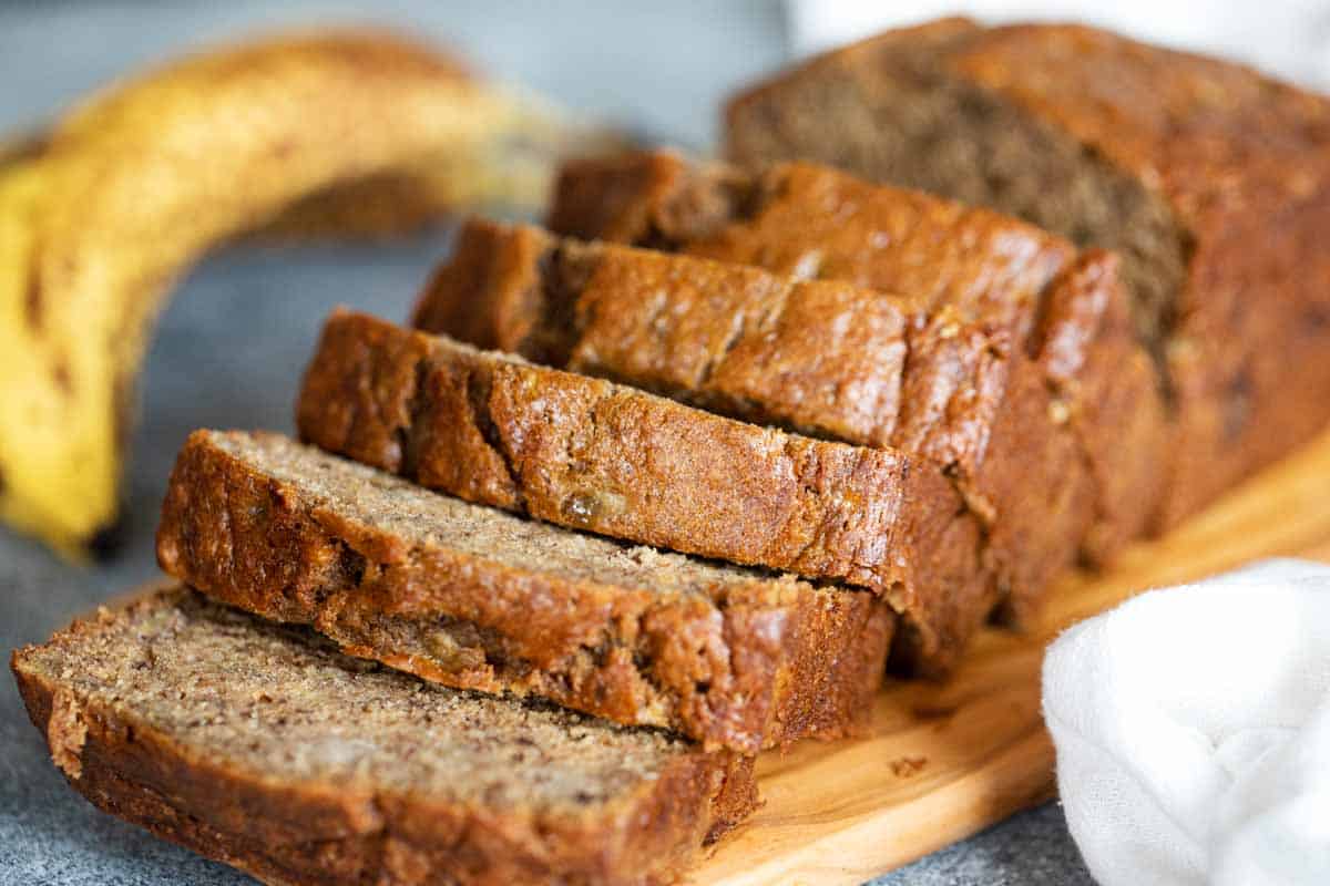 loaf of sliced banana bread on a cutting board