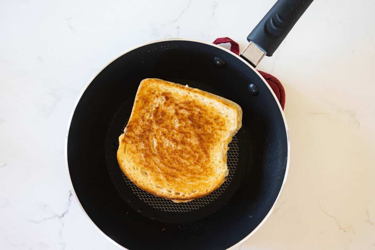 grilled cheese sandwich in a skillet