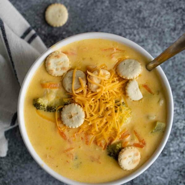 overhead view of a white bowl with broccoli cheddar soup