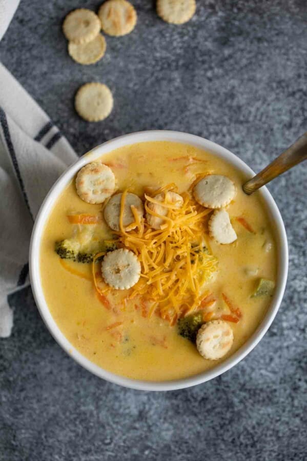 overhead view of a white bowl with broccoli cheddar soup