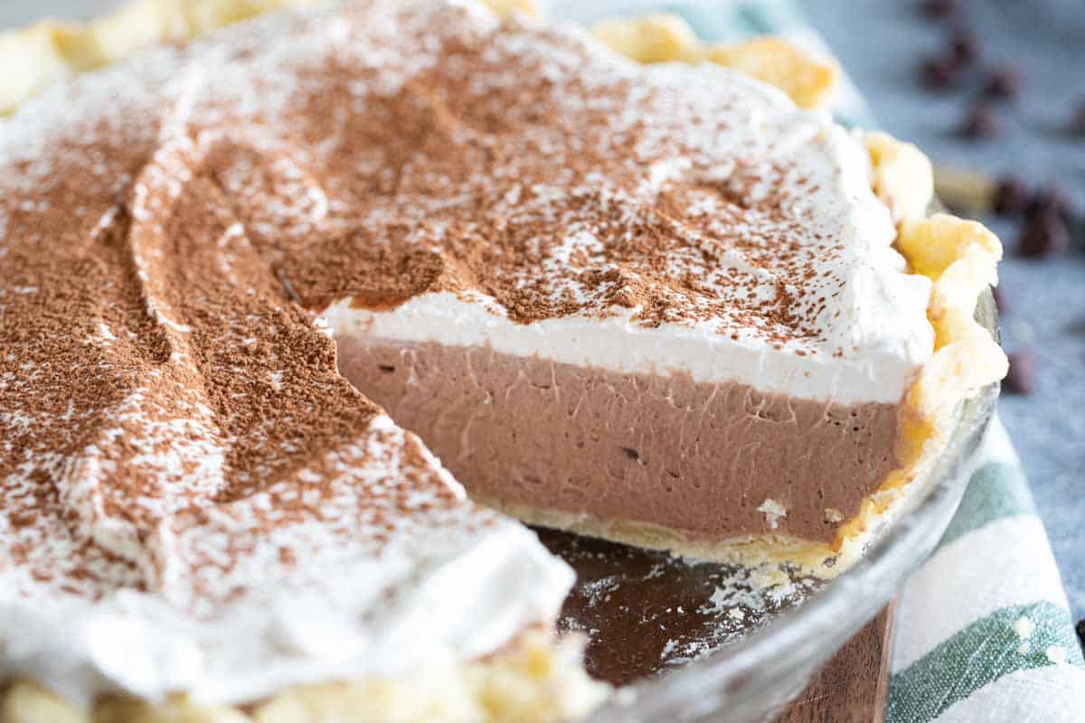 chocolate cream pie with slice out of full pie